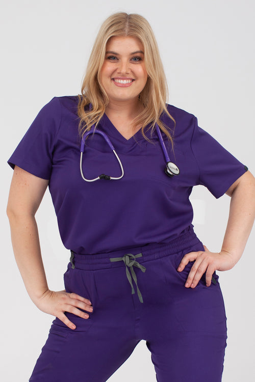 The Atmosphere One-Pocket Scrub Top - Iris Purple